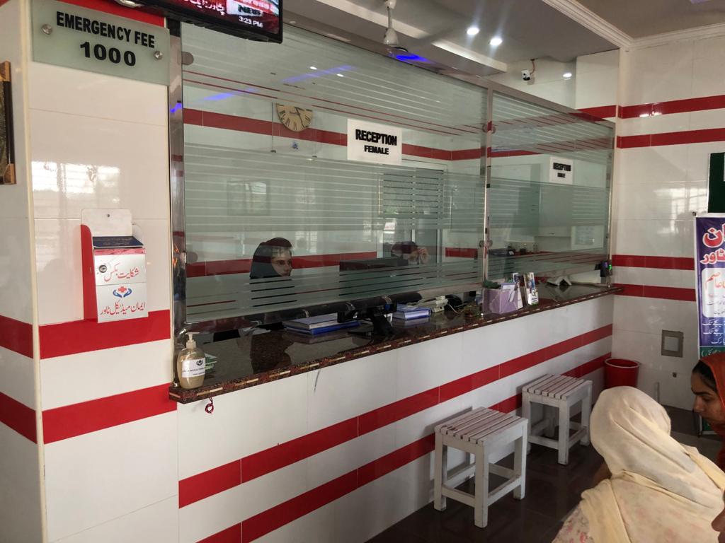 Front desk staff registering patients at Eman Medical Tower